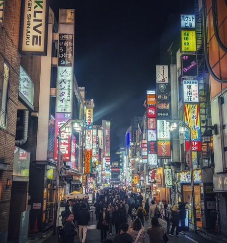 Shinjuku nightlife with lots of glaring lights.