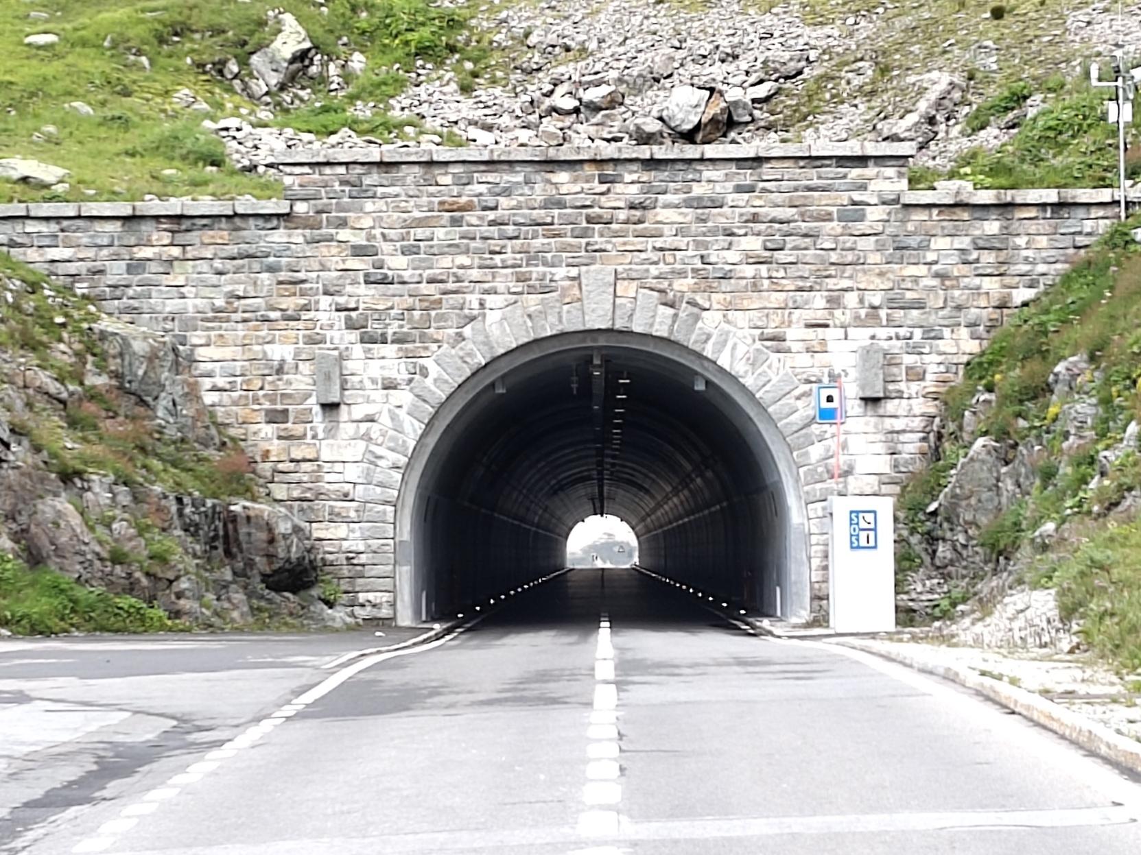 View of a nice round straight tunnel with light coming from the other end.