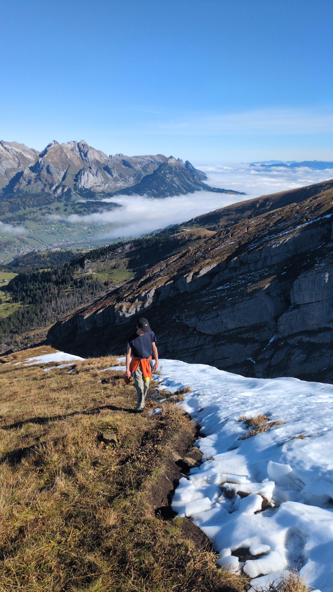 My son hiking up beneath a snow.