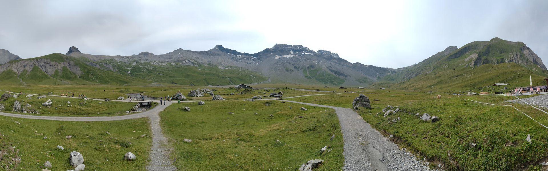 Panorama picture of a large flat area surrounded by mountains