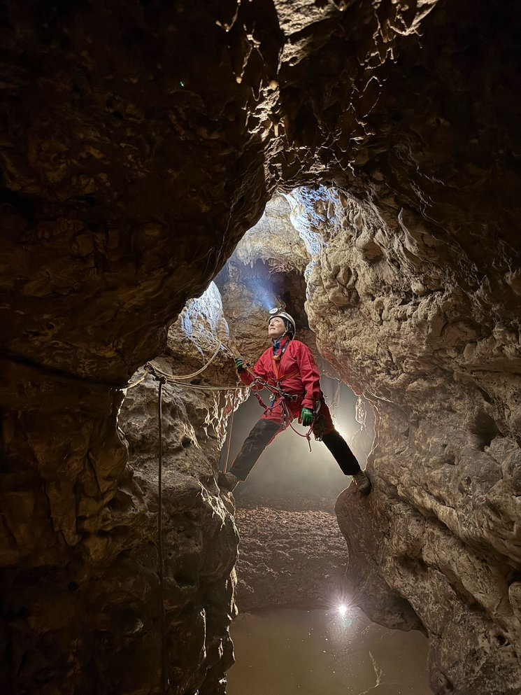 A moment of the progression in the cave over a small internal lake