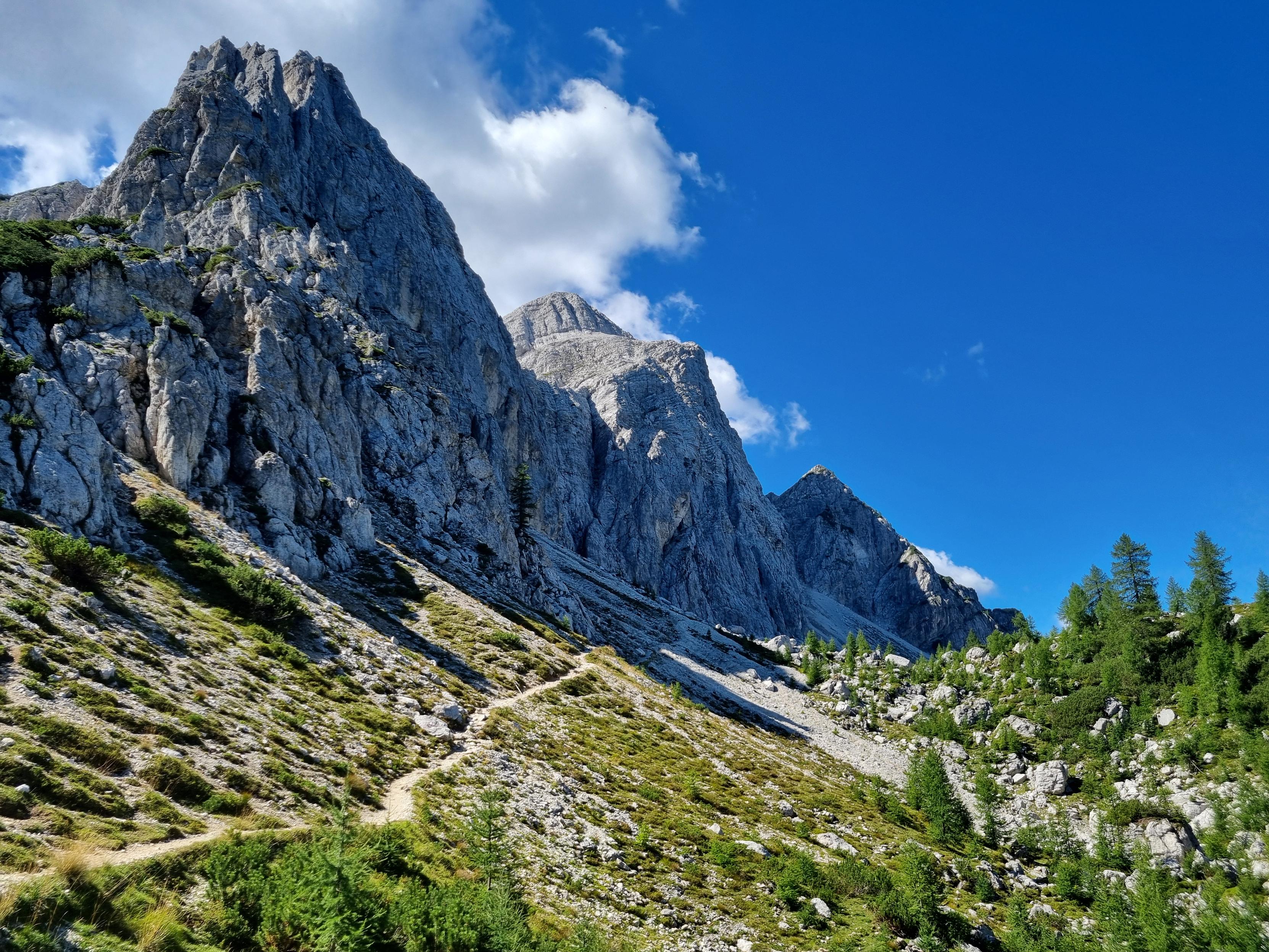 Trail in front  of mountain peaks